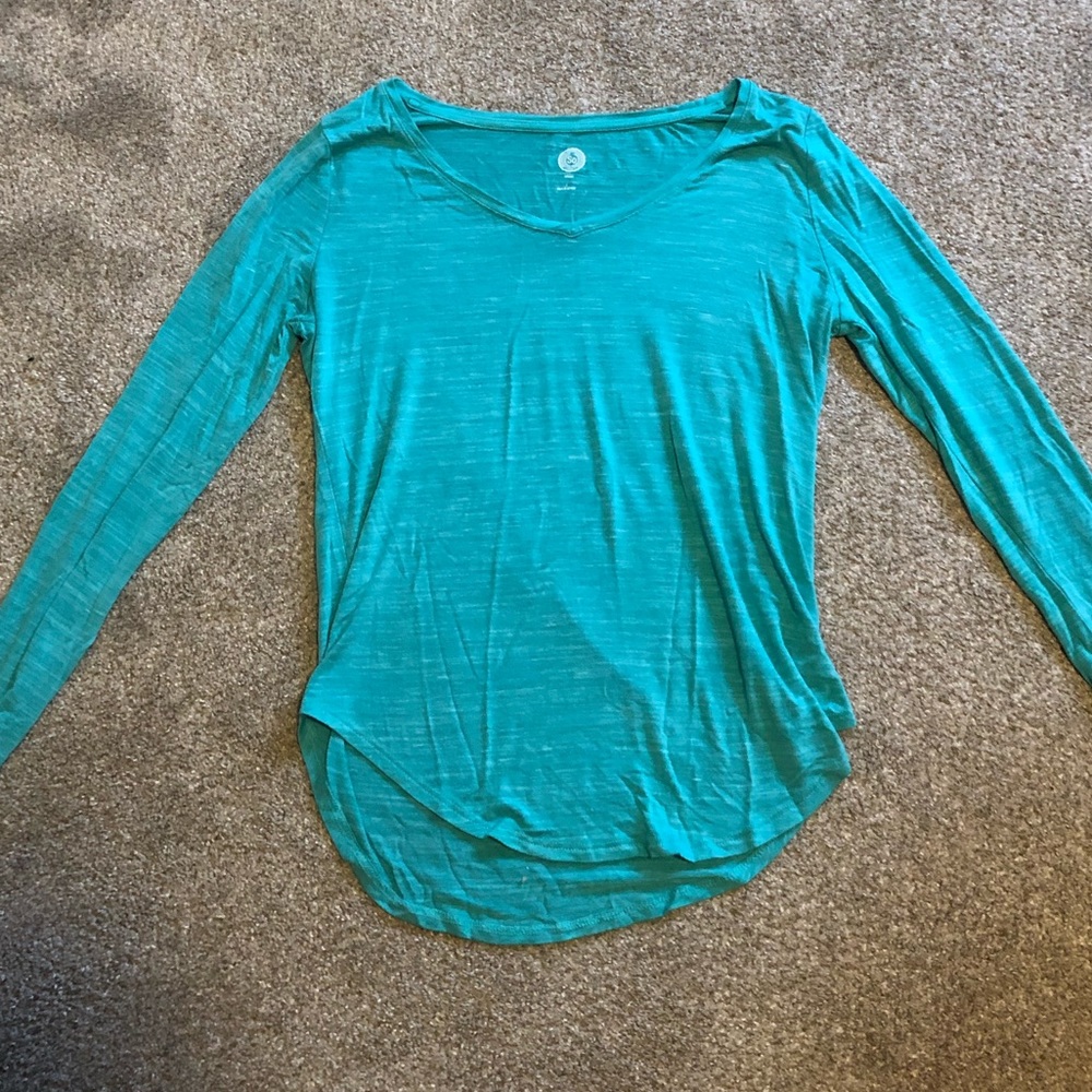 One blue and one pink long sleeved shirts